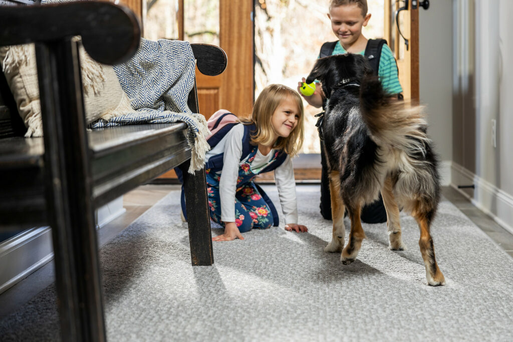 Kids on carpet floor with pet friendly | Messina's Flooring